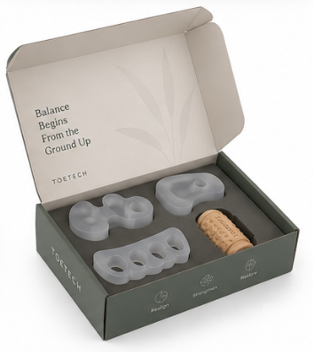 Open Toe-Bar Balance Kit showing bunion spacer pinky toe corrector and plantar fasciitis roller