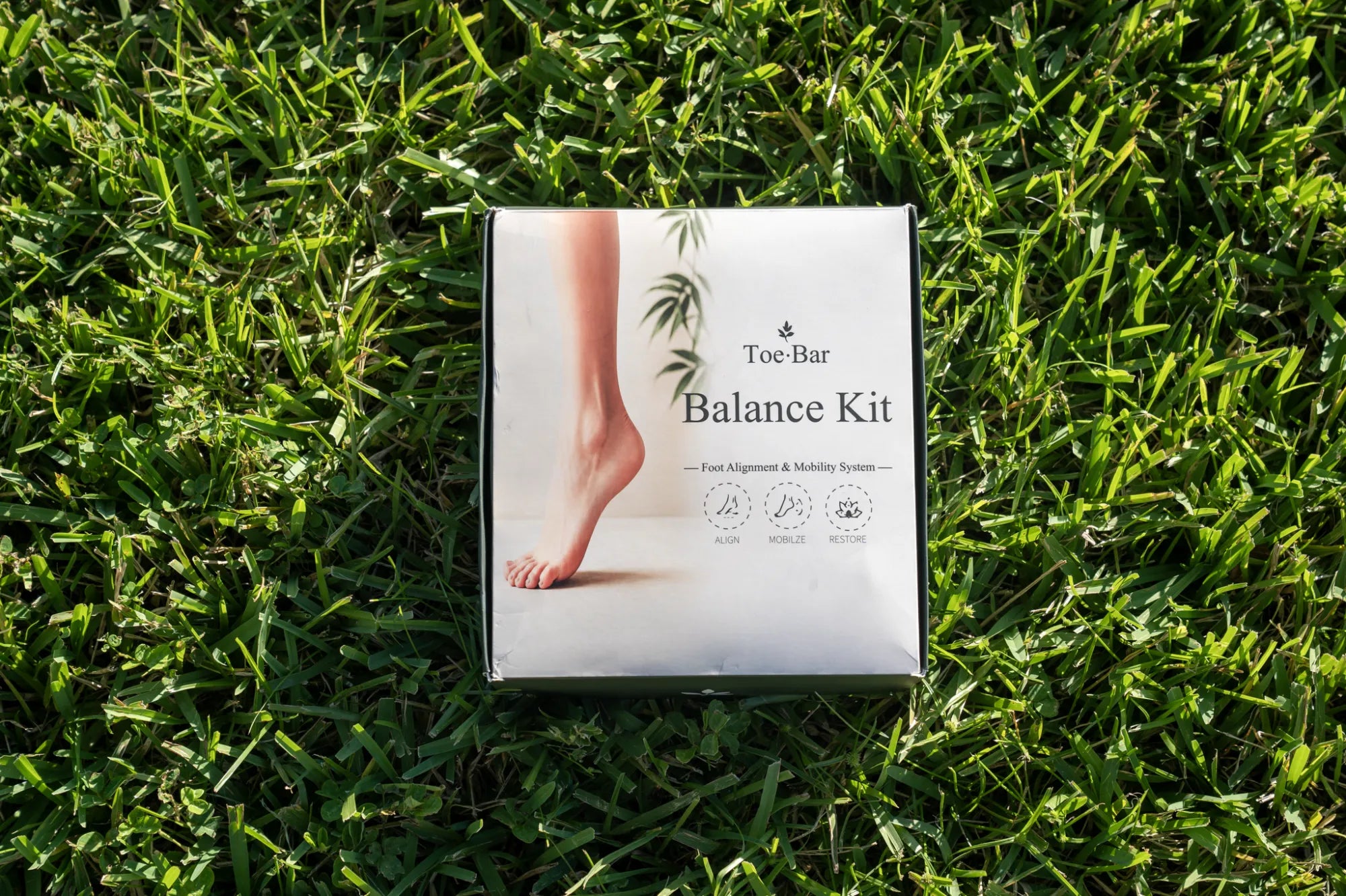Toe-Bar Balance Kit box top-down view showing Foot Alignment & Mobility System label with Align, Mobilize, Restore icons