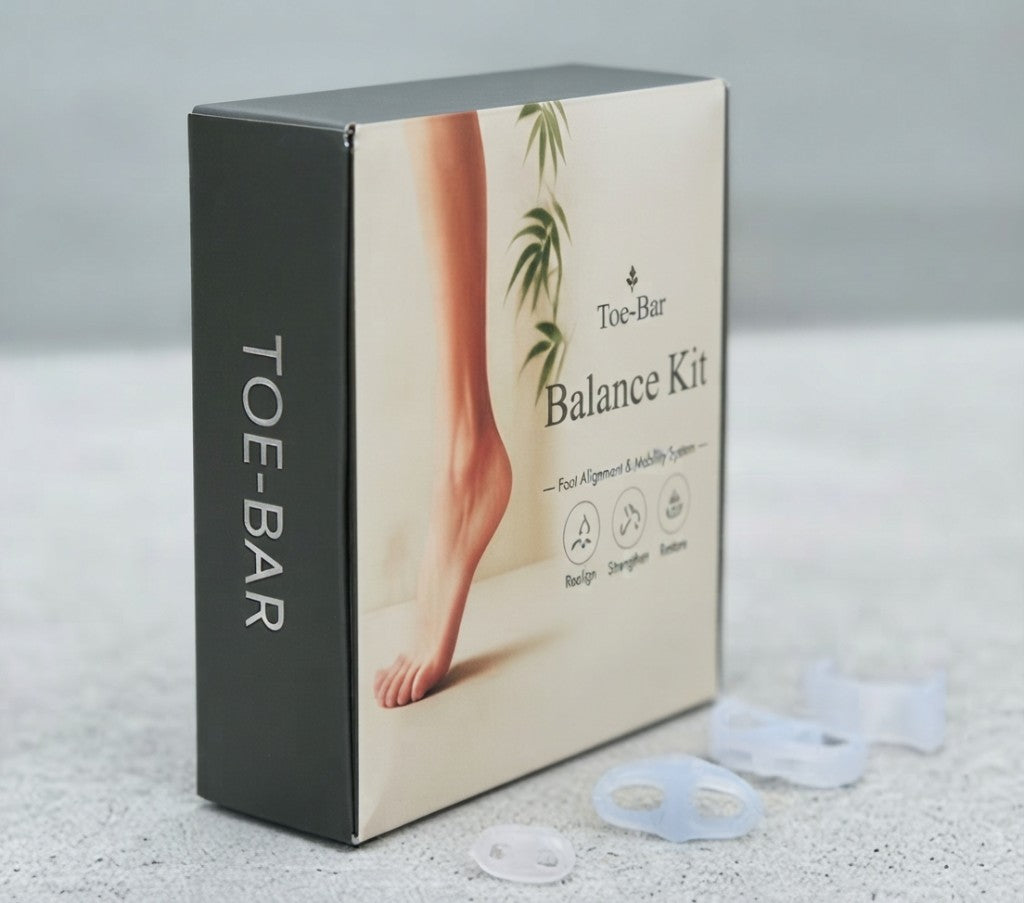 Toe-Bar Balance Kit retail box with clear silicone toe separators on a stone surface